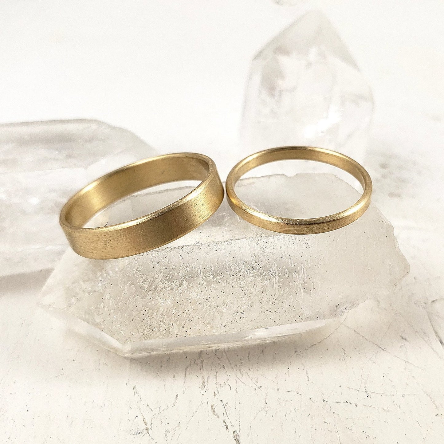 His and Hers classic wedding band set in solid yellow gold.